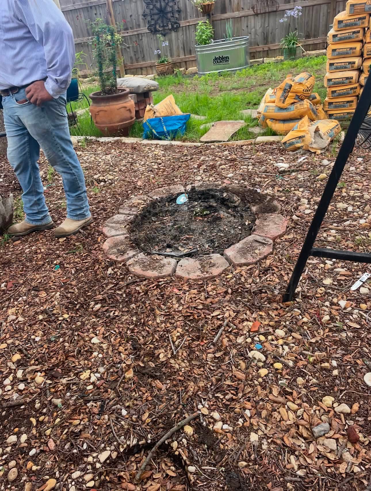 Backyard fire pit area before construction