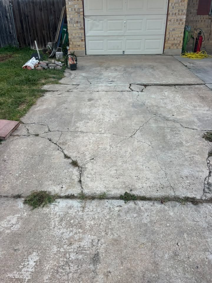 Cracked residential driveway before replacement